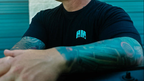 Man wearing Hard Mode Atheltics tee shirt